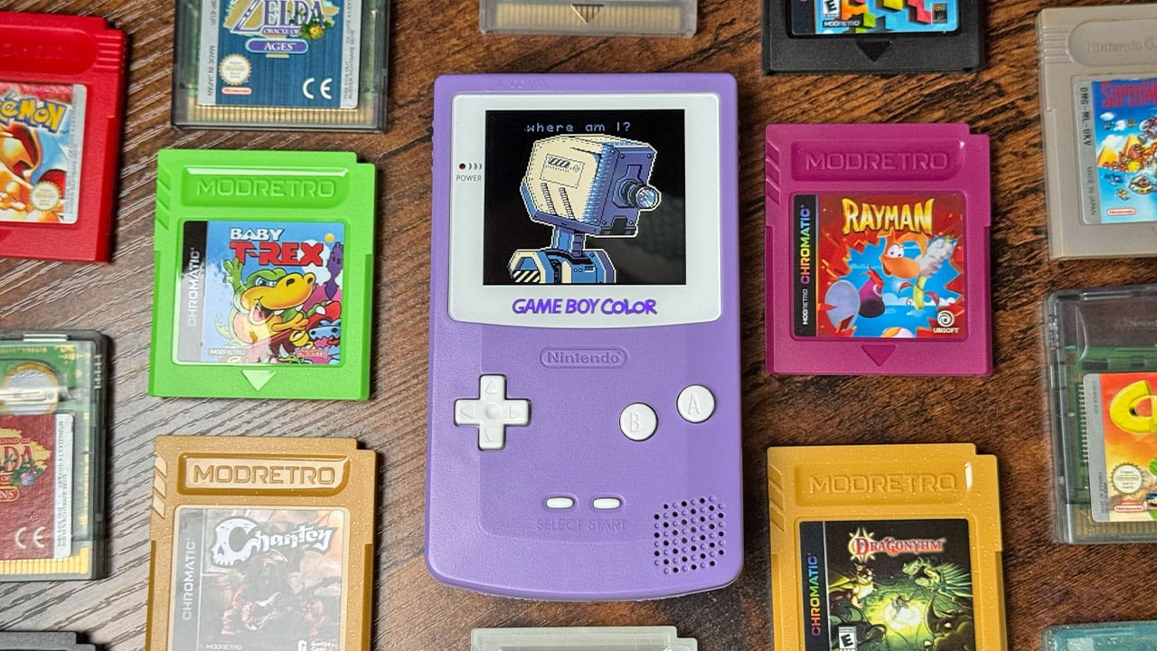 Self Simulated  on the Game Boy surrounded by cartridges